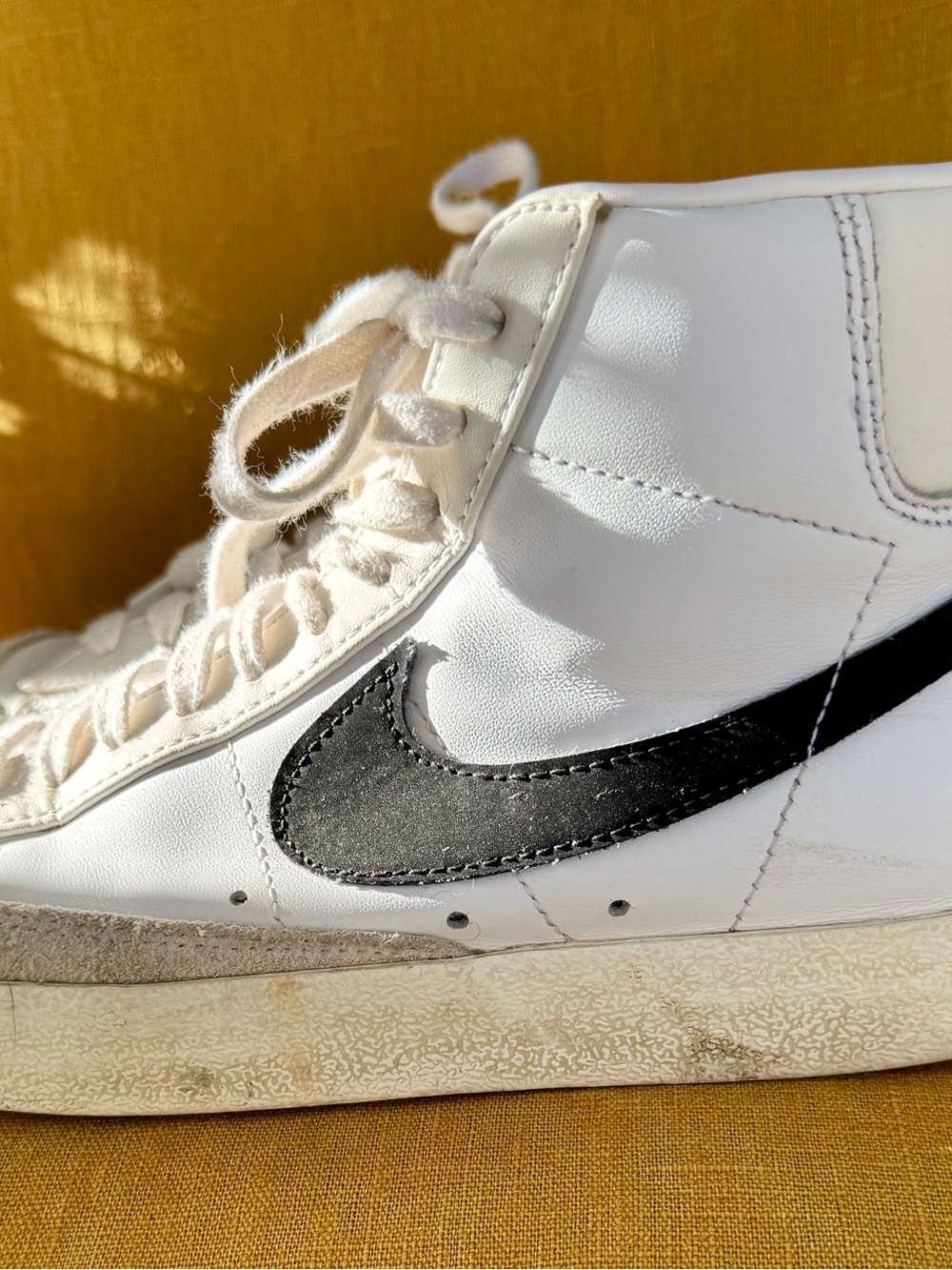 Nike White High-Top Sneaker with Black Swoosh